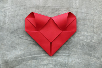Poster - one folding red paper heart on cement wall for valentine pattern