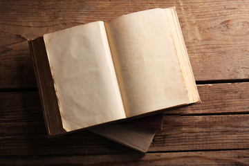 Sticker - Old books on wooden background, top view