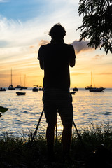 Wall Mural - silhouetted fisher boats in the bay of 