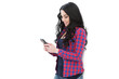 Young woman holding a smart phone while text messaging