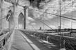 Empty Brooklyn Bridge footpath in a sunny day, New York in black and white