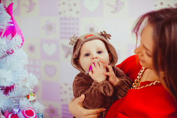 Wall Mural - young and happy mommy with her cute little boy