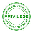 Grunge green privilege round rubber stamp on white background