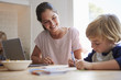 © Monkey Business - Mother watching son colouring at the kitchen table