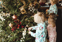 Children Decorating Christmas Tree 
