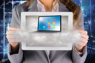 Poster - Composite image of businesswoman showing a tablet pc