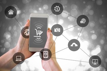 Poster - Composite image of hand holding smartphone