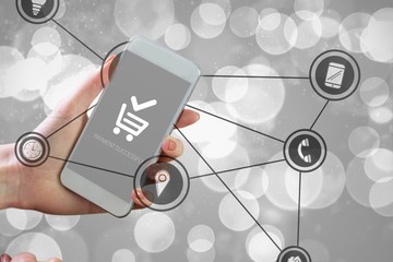 Poster - Composite image of hand holding smartphone
