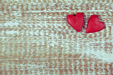 Two hearts on wooden texture background. Valentines day card concept. Original  vintage background. 