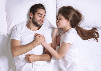 Wall Mural - Young cute couple together in bed