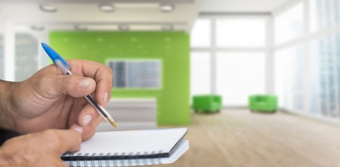 Poster - Composite image of close up of man writing in notepad