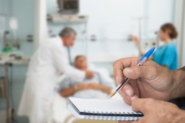 Canvas Print - Composite image of doctor checking patient with stethoscope