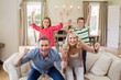 © WavebreakMediaMicro - Portrait of parents and kids having fun in living room