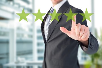 Poster - Composite image of businessman pointing with his finger