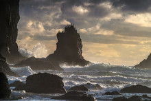 Light Fades And The Waves Break Over The Rocks Offshore At Cannon Beach While Gulls Watch The Show