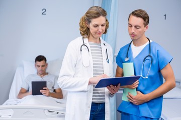 Wall Mural - Doctors examining reports 