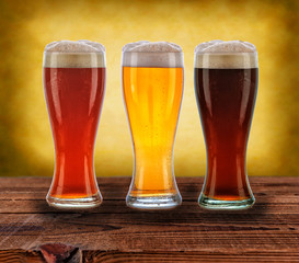 Wall Mural - Three Beers on Wood Table