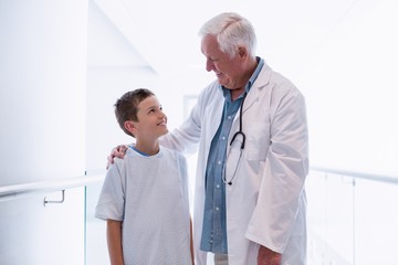 Poster - Doctor talking to boy patient