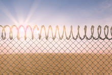 Composite Image Of Barbed Wire Fence By White Background