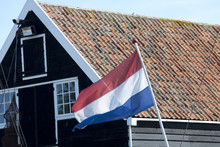 Houses At Zuiderzee Museum With Dutch Flag