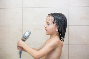 Poster - Cute child, holding tablet, taking shower