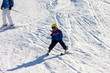 © Tomsickova - Father and son, preschool child, skiing in austrian ski resort in the mountains, wintertime