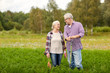 © Syda Productions - senior couple with shovel picking carrots on farm
