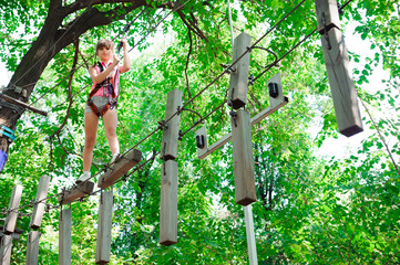 Wall Mural - adventure climbing high wire park - hiking in the rope park girl