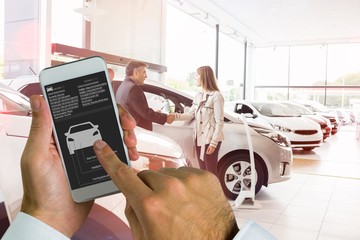 Poster - Composite image of hand holding smartphone