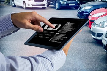 Poster - Composite image of man using tablet pc 