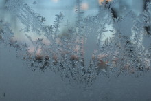 Abstract Photo. Frost On Window Glass - Blue Yellow Frozen Window Glass Through Magnifying Glass 