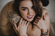 © ADDICTIVE STOCK - Embraced woman looking at camera