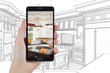 Hand Holding Smart Phone Displaying Photo of Custom Kitchen Drawing Behind.