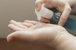 female hands using antibacterial hand soap