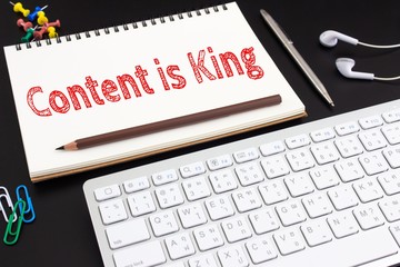 Word text Content is king on white paper on office table / business concept