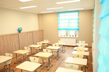 Sticker - Empty classroom with chairs and desks