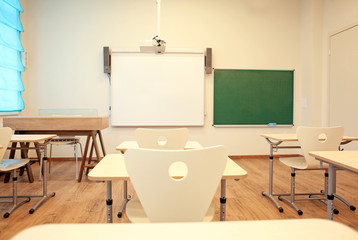 Sticker - Empty classroom with chairs and desks