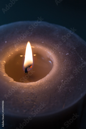 Grossa Candela Accesa Con Piccole Candele Accese In Lontananza Su Sfondo Chiaro Buy This Stock Photo And Explore Similar Images At Adobe Stock Adobe Stock