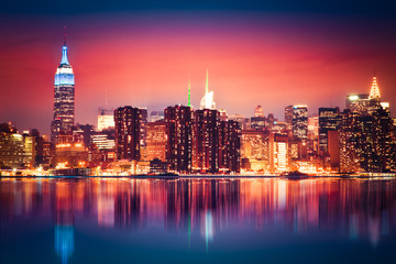 Fototapete - New York City skyline of Manhattan with vibrant night colors
