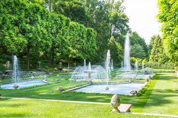 Canvas Print - Fountains in park at sunny day.