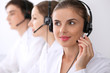 © rogerphoto - Call center. Focus on beautiful woman in headset