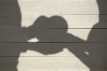 Poster - Composite image of couple holding heart shape gift