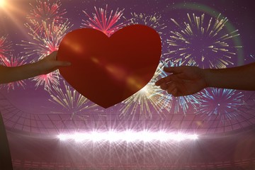 Poster - Composite image of woman giving heart card to her boyfriend 