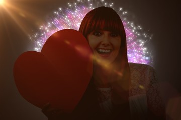 Poster - Composite image of smiling hipster woman with a big red heart