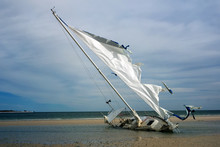 Broken Yacht With A Torn Sail Aground. Gulf Coast, Florida, St.