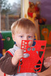 Little boy playing and learning in preschool