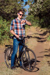 © Александр Беспалый - The young guy sits on bicycle.