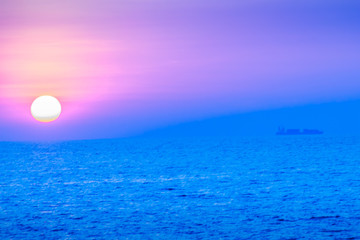 Wall Mural - Beautiful sunset over the sea, view from the beach. Round and br