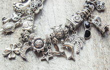 Bracelet With Pendants Charms On The Summer Theme. Selective Focus.  