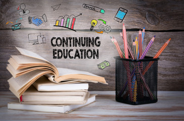 Wall Mural - Stack of books and pencils on the wooden table.